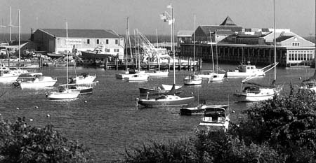 Wychmere Harbor as seen from the overlook on Main Street. Harwich Port Boat Works is on the east side of the channel and the Wychmere Harbor Club is on the right.